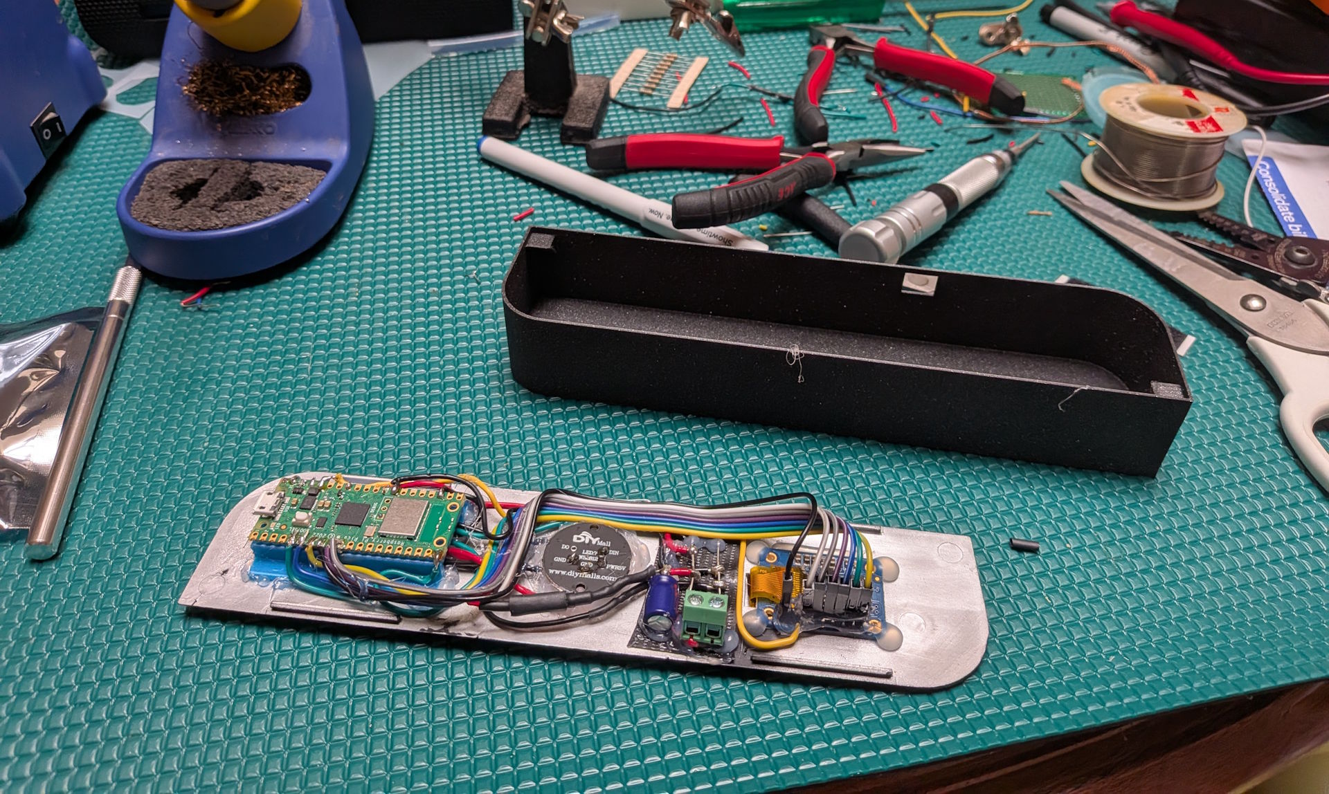 The board on the bench, mid-assembly